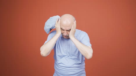 Old-man-with-migraine-is-experiencing-pain.